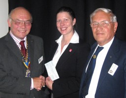 President David Pickover presents a cheque to Emma Riley of School 4 All on 25.09.08. Looking on is Rotarian David Oughtibridge