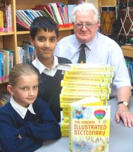 WORD PERFECT Eleven-year-olds Louisa Liddicott and Harris Tasab with Rotarian Roland Mold at Sandal Magna school